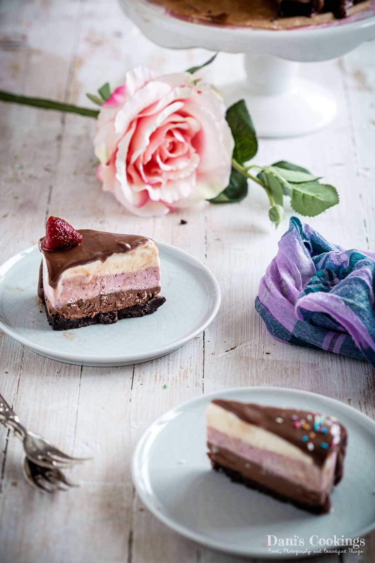 two slices of neapolitan ice cream cake