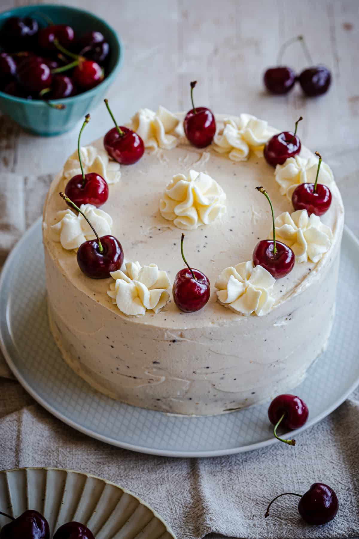 white cake with cherries