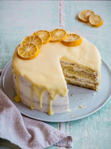 lemon mascarpone cake with two slices taken