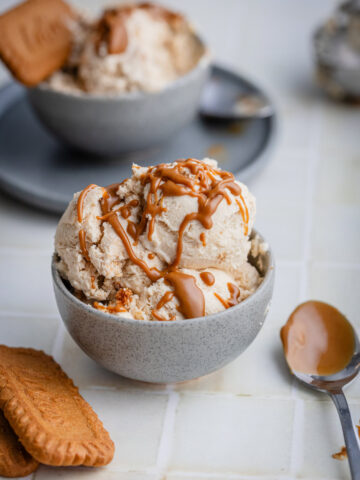 ice cream with biscoff spread on top in a small bowl